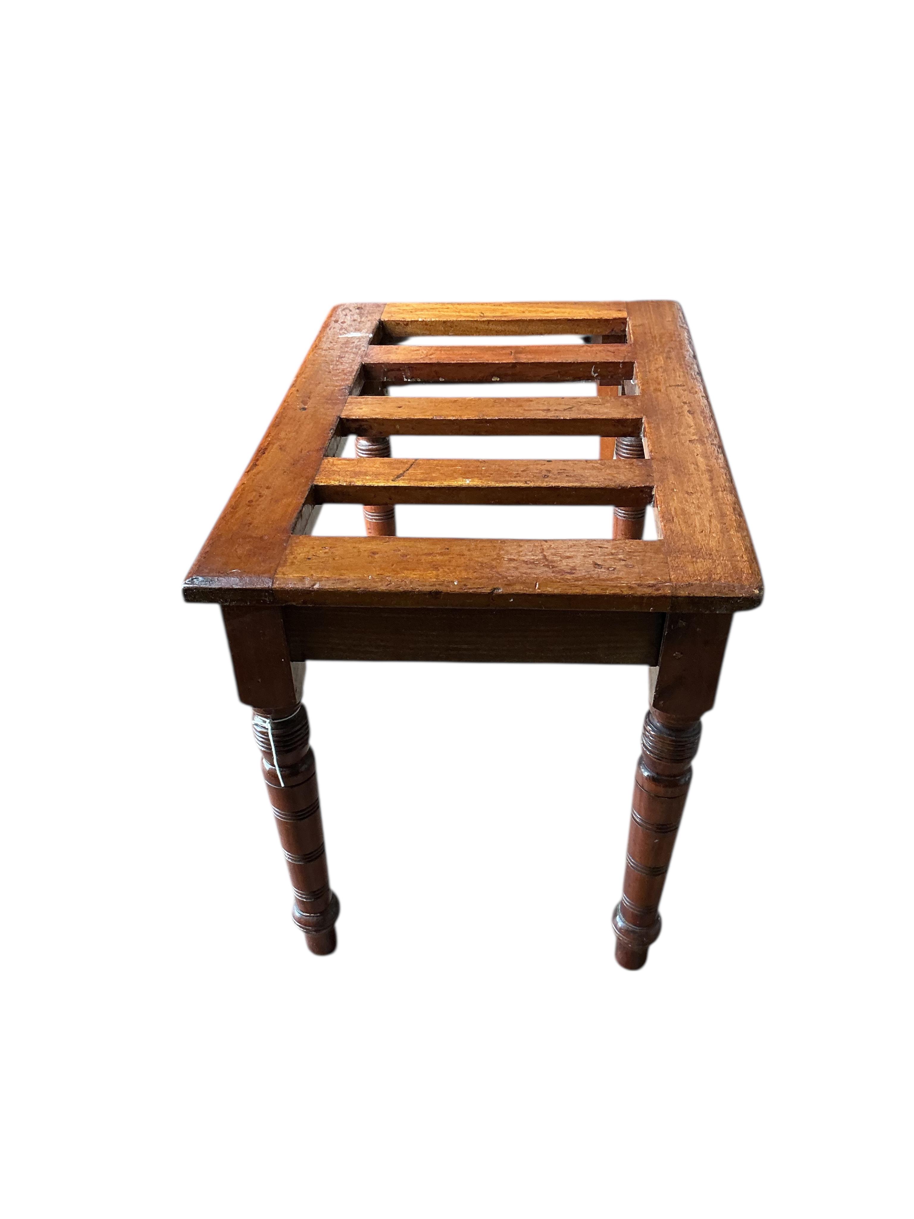 A late Victorian mahogany luggage stand, width 61cm, depth 41cm, height 46cm